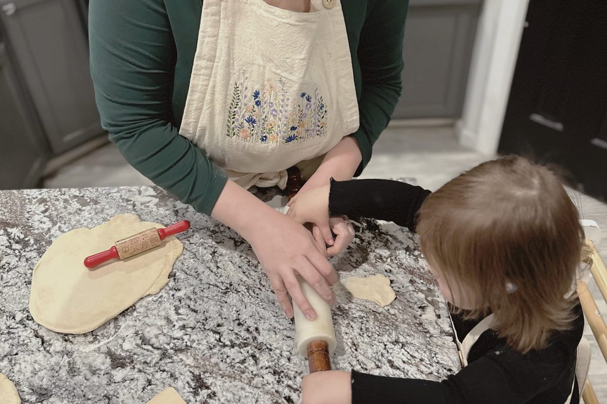 Module 7, Milling Schedule for Busy Moms: rolling out dough together at the kitchen counter